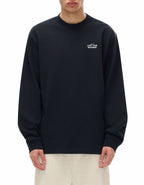 Person wearing black long sleeve t-shirt with "Told to love your neighbor" on the chest in white text