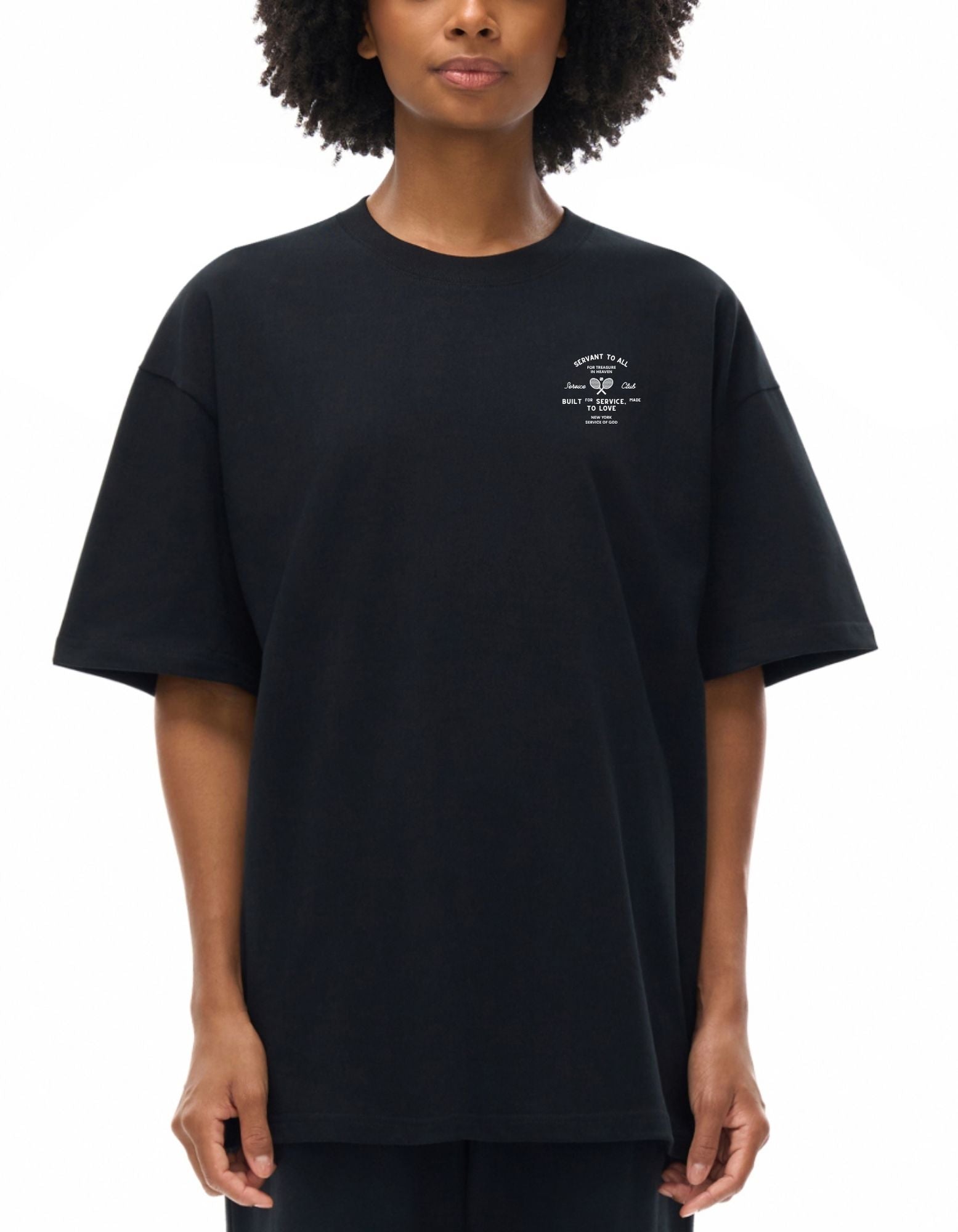 Person wearing a black t-shirt with a small white graphic on a white background
