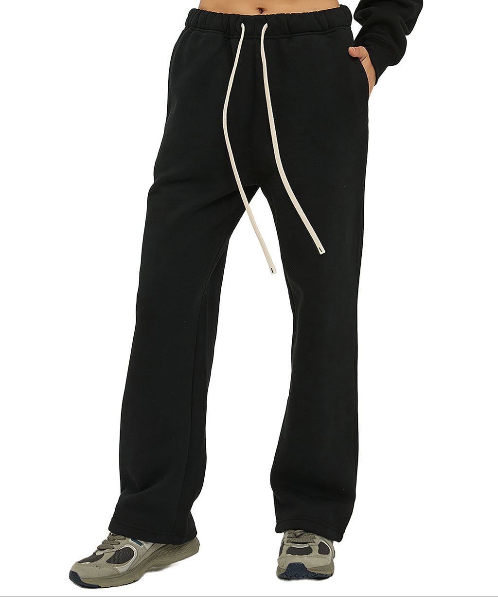 Black sweatpants with a white drawstring on a white background