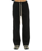 Black sweatpants with a drawstring on a white background