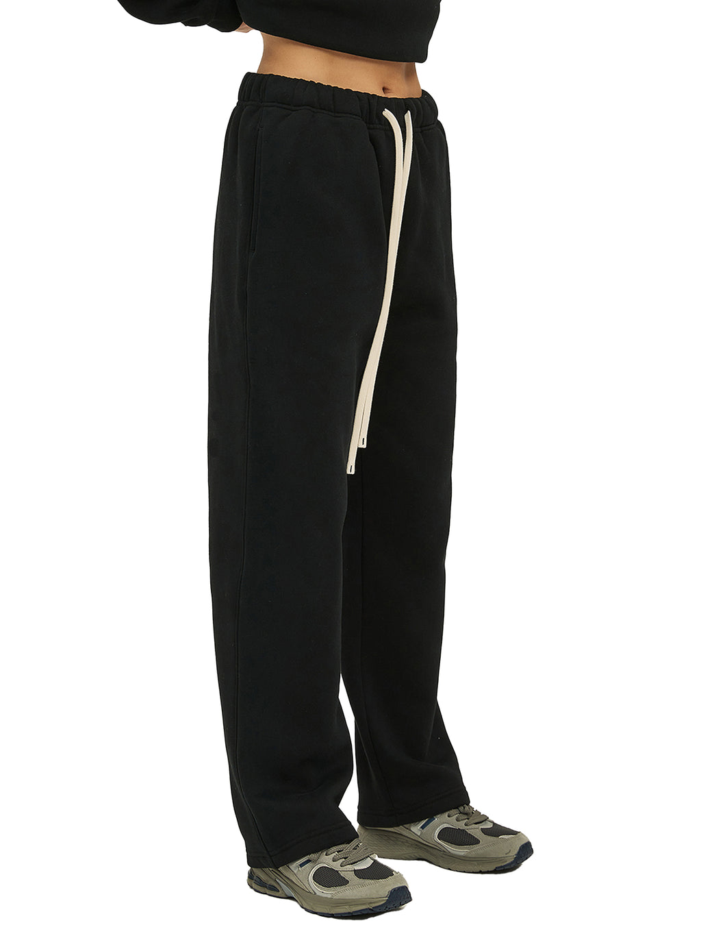 Black sweatpants with a white stripe on a white background