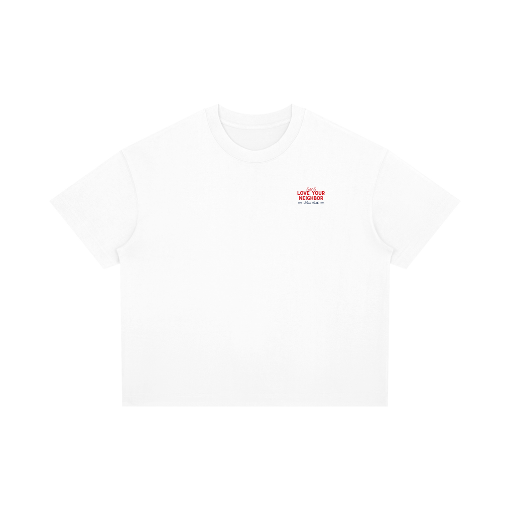 White t-shirt with red text saying told to love your neighbor on a white background