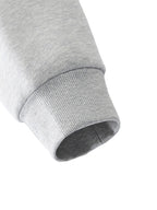 Close-up of a gray sweatshirt sleeve on a white background. grey christian crewneck