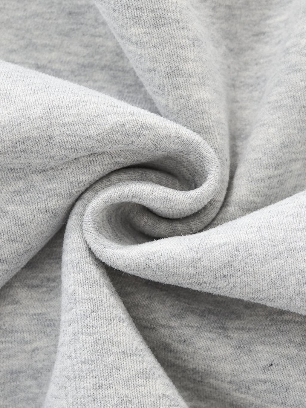 Close-up of gray fabric with a focus on texture and folds. grey christian crewneck
