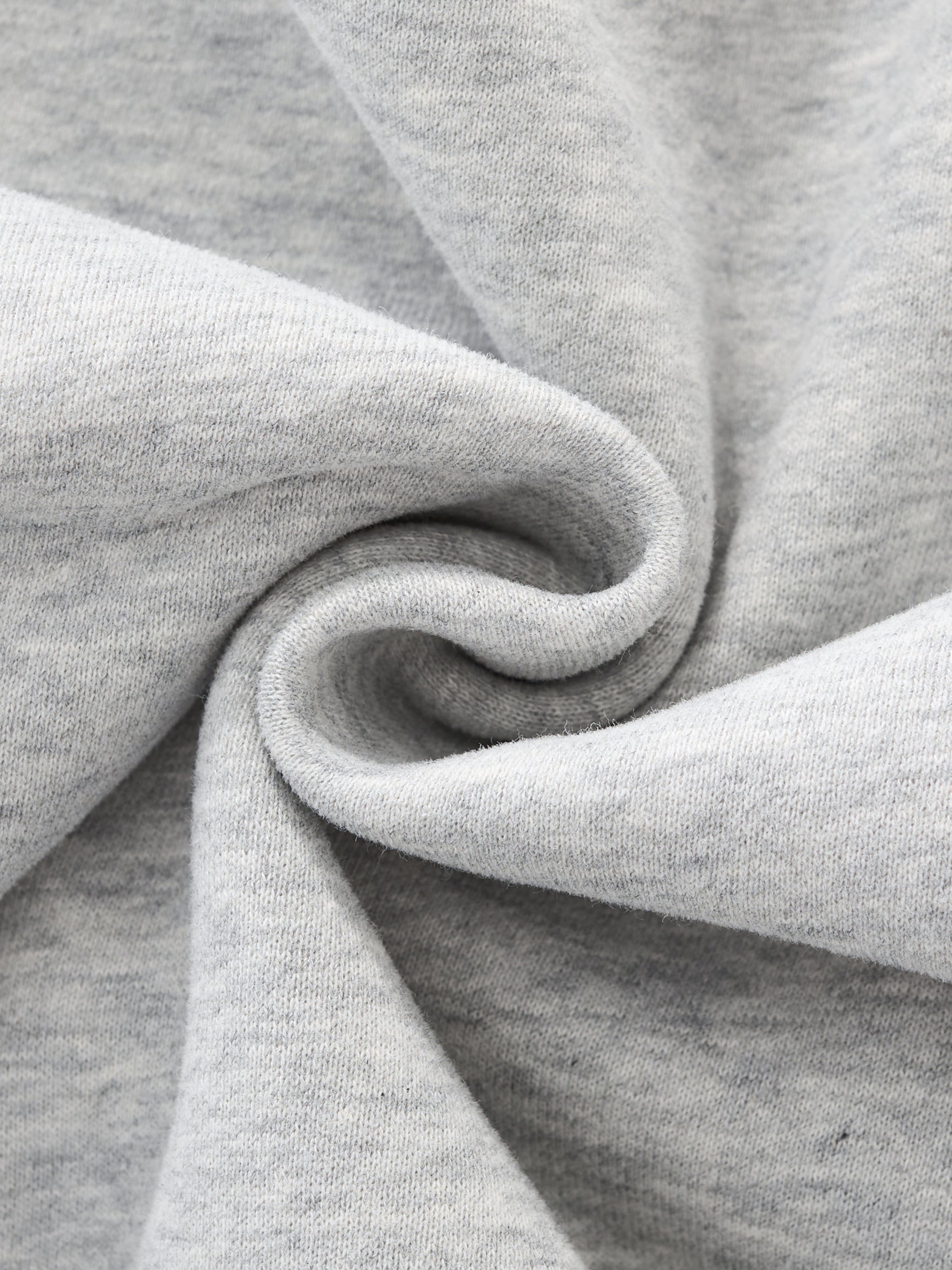 Close-up of gray fabric with a focus on texture and folds. grey christian crewneck