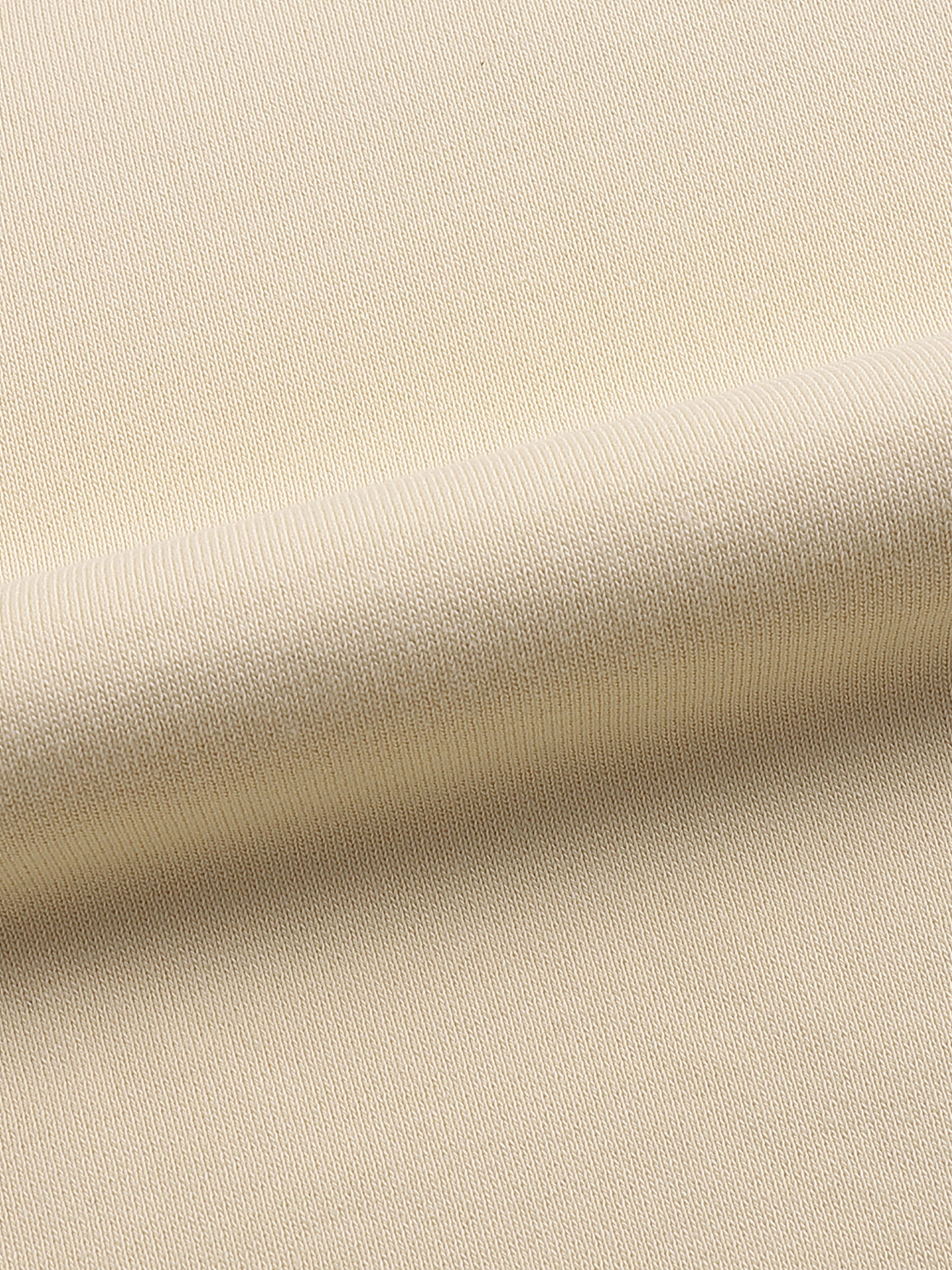apricot crewneck fabric details. 100% cotton.